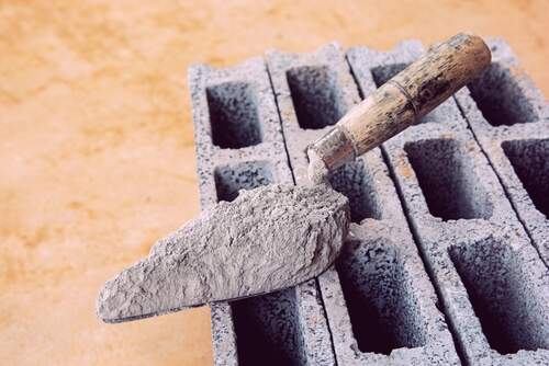 Shovel kept on Cement Bricks | UltraTech Cement