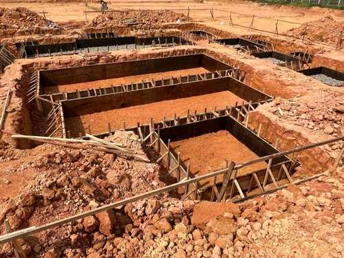 Formwork for pad footing.  Construction of pad footing foundation where the pads are used to support columns or structural framework within the superstructure.  