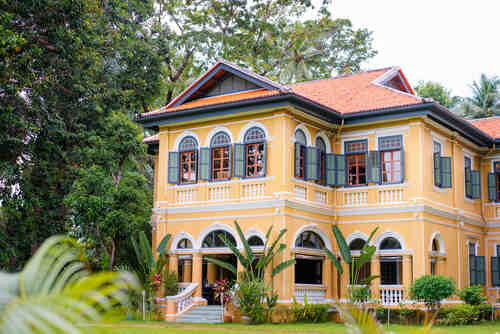 The facade of beautiful ancient house in colonial style.