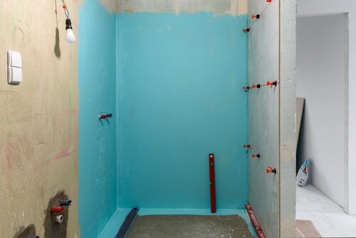 Wall waterproofing in a shower cabin. A bathroom in renovation