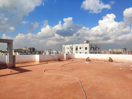 Roof top Lime Terracing work by Lady worker. 