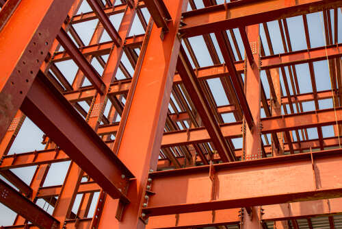 Red colored steel beam skeleton construction