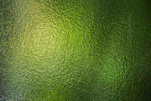 Green stained glass window texture.